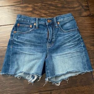 Madewell blue high rise denim shorts in a size 24.